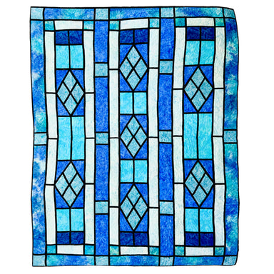 A square textile or rug featuring a stained-glass-inspired geometric pattern in shades of blue, light blue, white, and black outlines, shown flat against a plain white background.