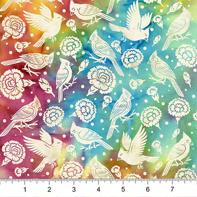 Colorful fabric pattern with birds and flowers, ruler at the bottom for scale.