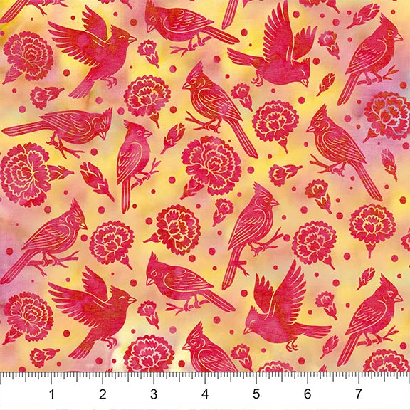 Fabric with red cardinal birds and pink flowers on a yellow background, ruler at the bottom for scale.