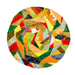A round patchwork quilt featuring a vibrant, multicolored geometric pattern of various fabric pieces in orange, green, yellow, red, blue, and brown, isolated on a white background.