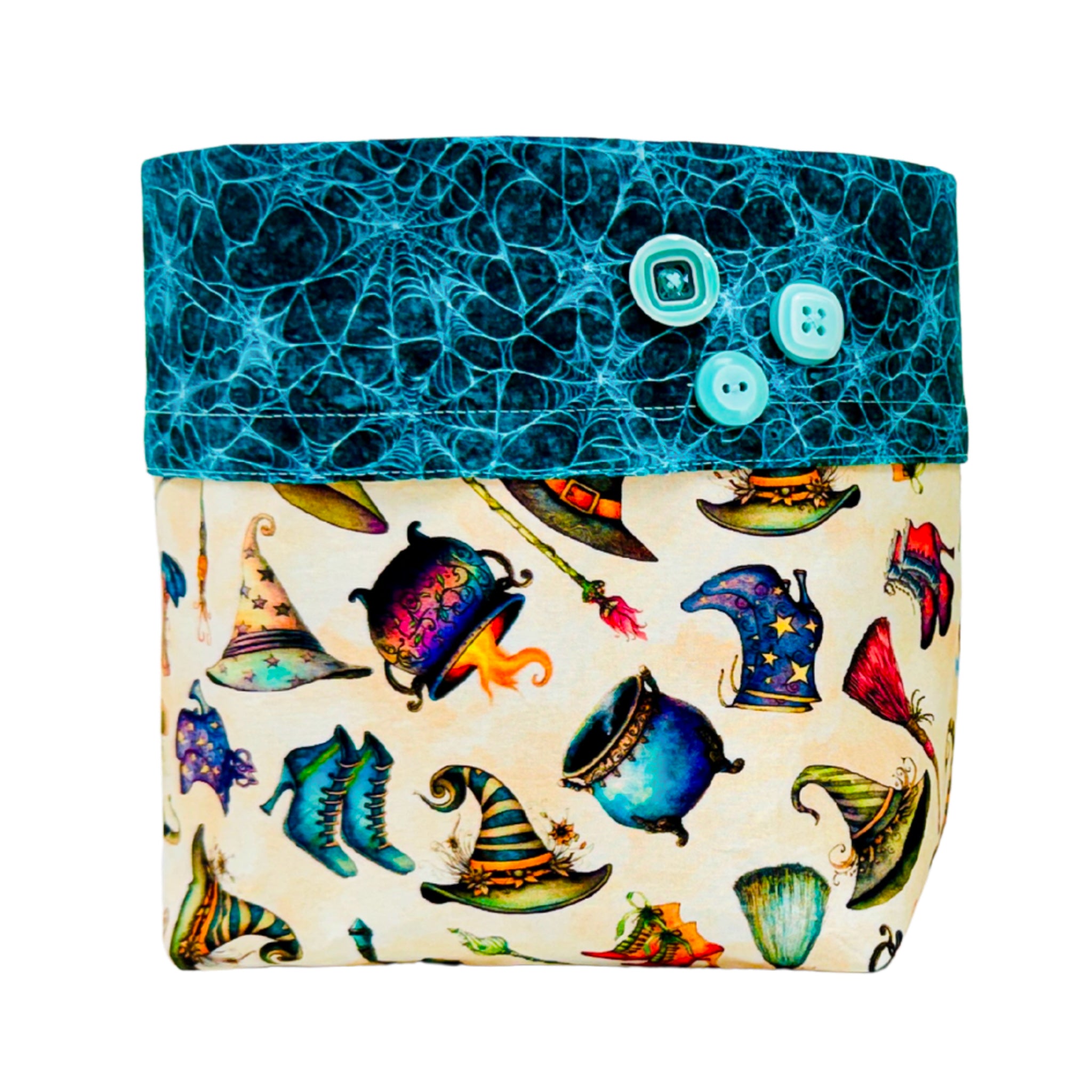 A fabric pouch with a two-tone design. The top flap is dark teal with a spiderweb pattern and three light blue buttons.