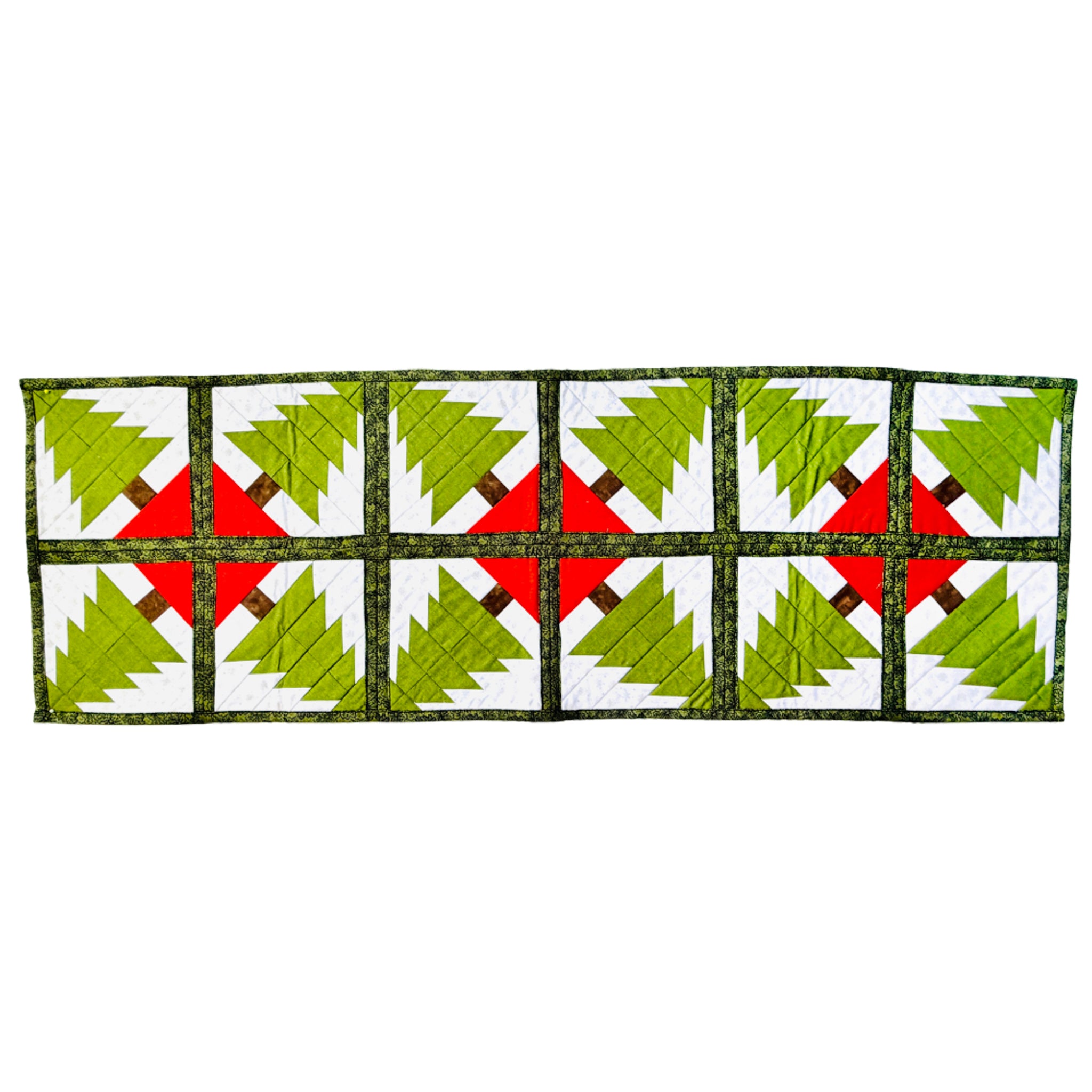 A rectangular quilted table runner featuring a repeating pattern of green Christmas trees on white panels, separated by red X-shaped centers and dark green borders.