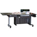 A white, height adjustable sewing table with an electric lift and a filler panel, equipped with wheels for mobility.