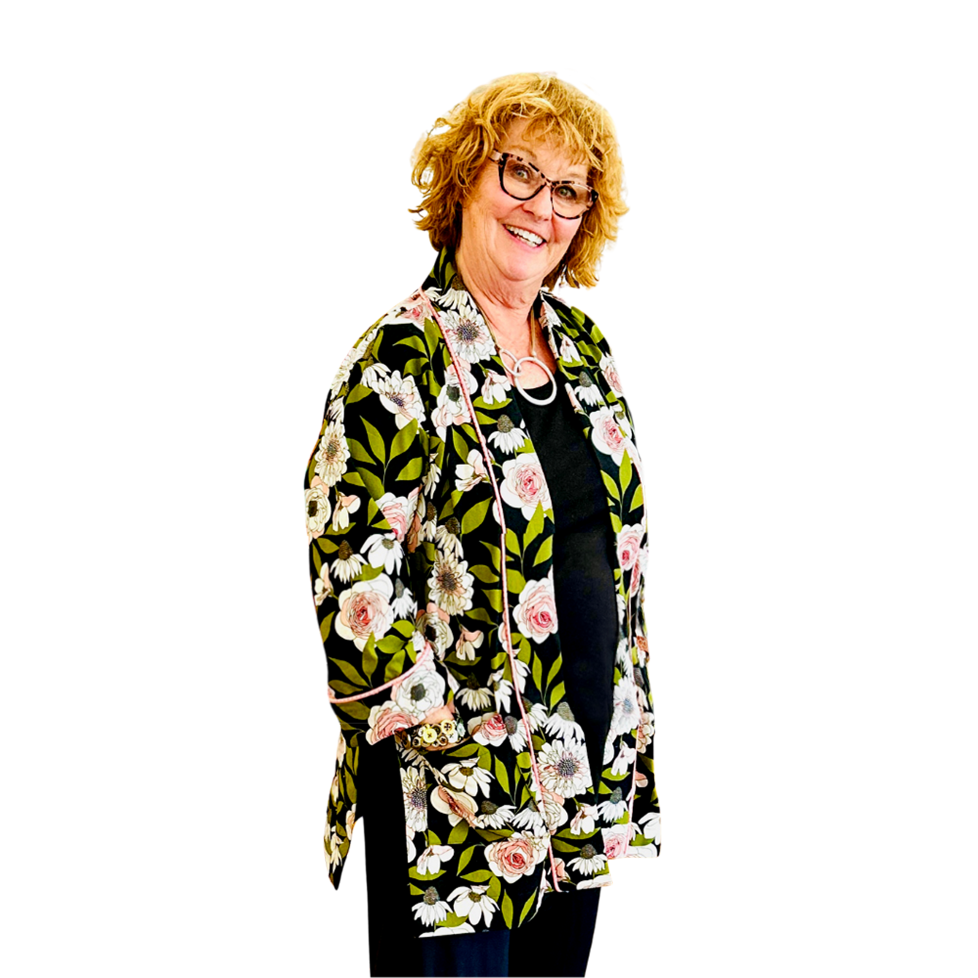 Woman wearing a floral patterned jacket on a white background