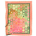 A square scarf with a dense floral and geometric pattern, featuring a coral pink border and a multicolor center with pink, green, and orange motifs.