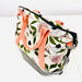 Floral-patterned bag with pink straps on a white background