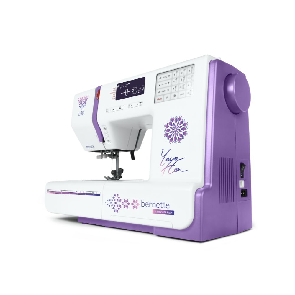 Purple and white bernette sewing machine on a white background