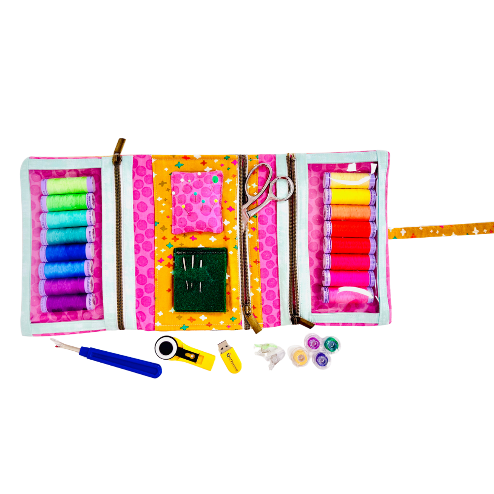 Colorful sewing kit with thread, scissors, and other tools on a white background