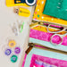 Collection of sewing and craft supplies including a USB drive, scissors, and thread on a white background.