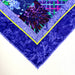 Colorful quilt with floral patterns on a white background