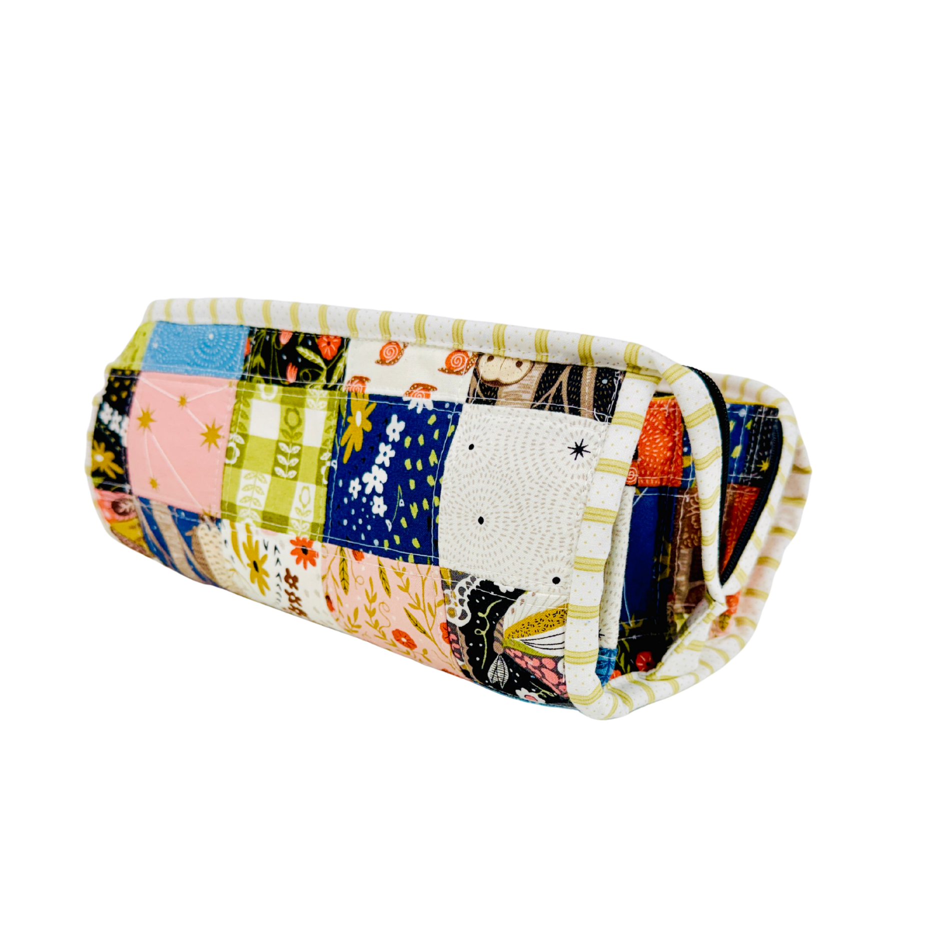 Folded quilt with colorful patchwork pattern on a white background