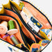 Colorful sewing kit with threads and tools in a patterned case